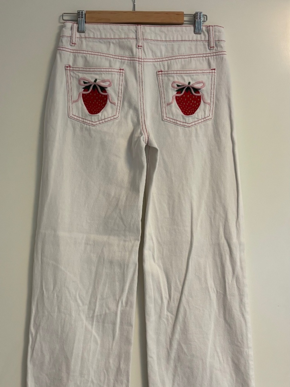 Edikted white jeans with strawberries (size women’s small)